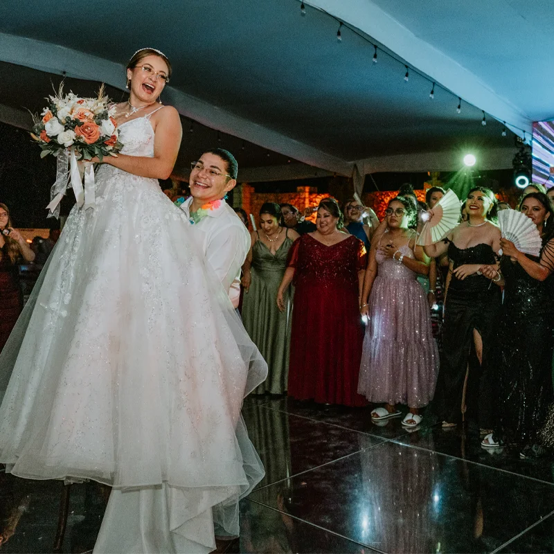 Guests waving ribbons at a reception table