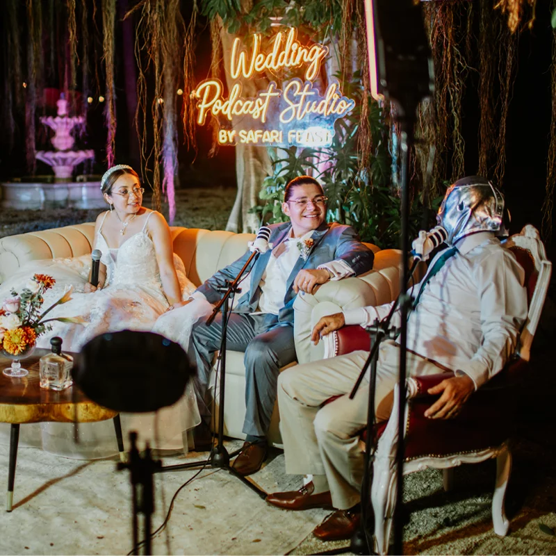 Family and friends smiling at a reception table