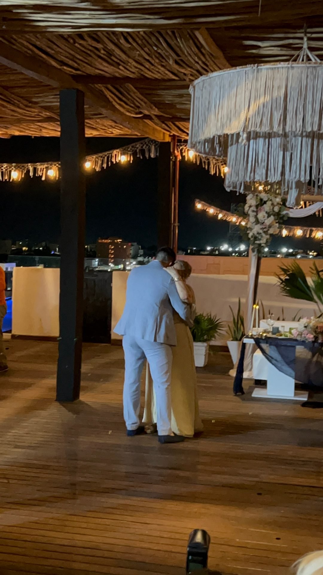 Bride and groom first dance at sunset